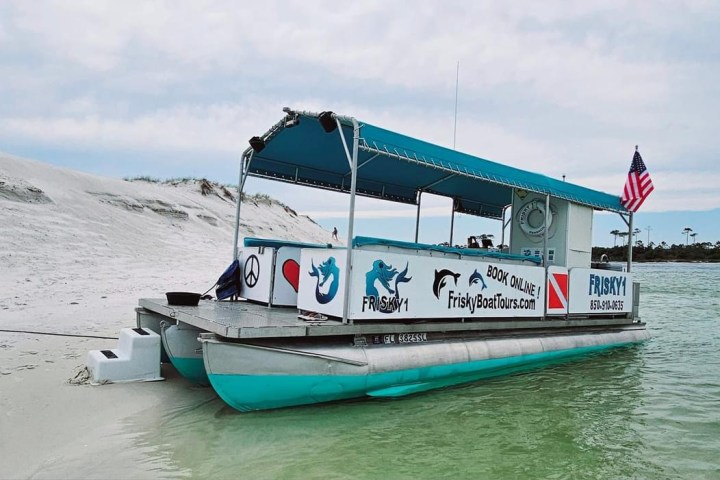 dolphin boat beached at Sand Island
