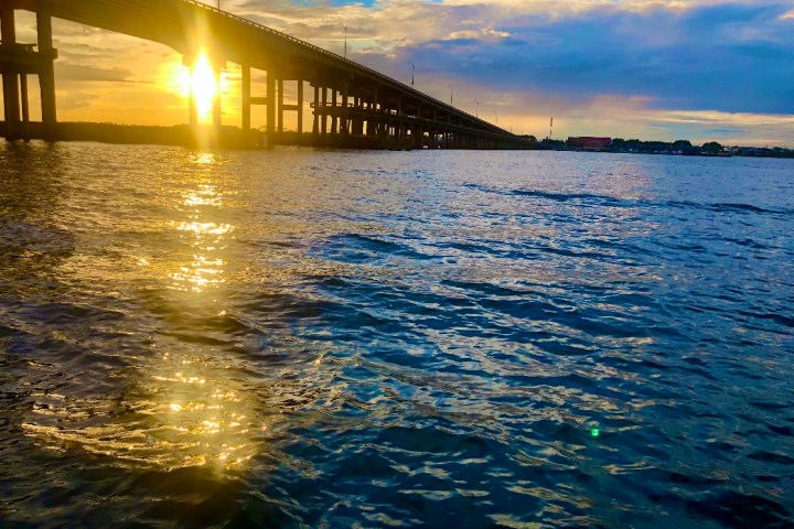 A sunset behind the bridge on Frisky Mermaid