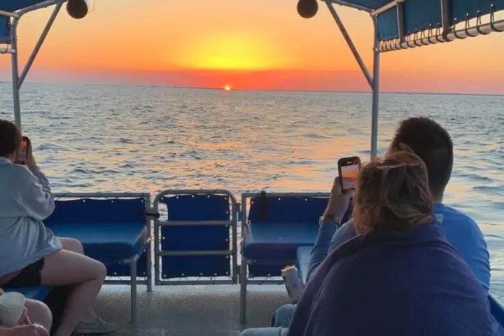 Gorgeous sunset on the horizon of Friskty1 Dolphin Tour boat