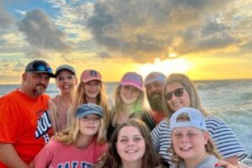 Family posing for a sunset family shot onboard Frisky Mermaid
