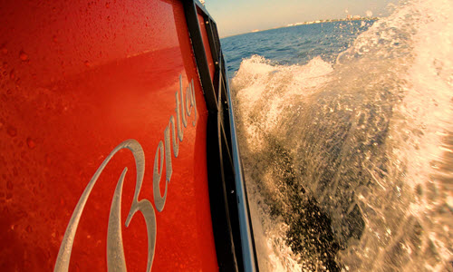 Frisky Mermaid pontoon boat rental on Pensacola Beach on a sunny day