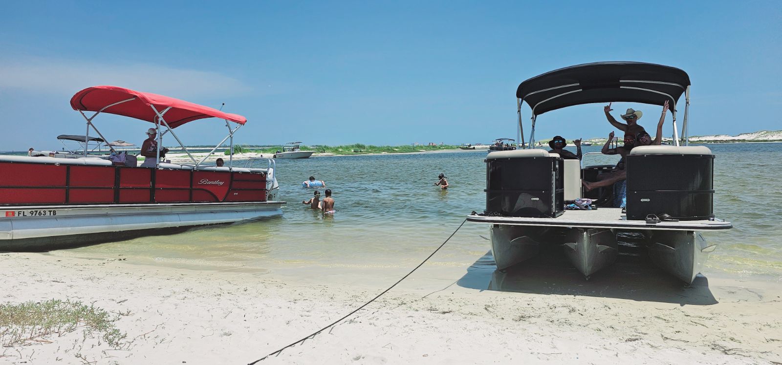 Pontoon boat rental group on Pensacola Beach with life jackets