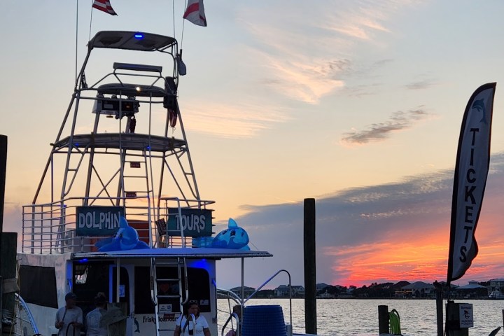 Frisky Mermaid boat docked with a Sunset cruise Pensacola florida