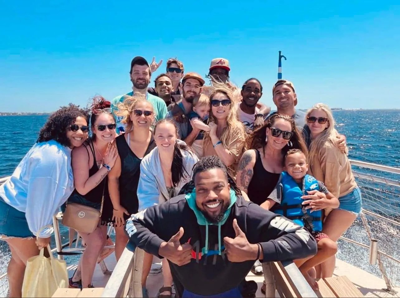 Family enjoying a dolphin cruise in Pensacola Beach aboard the Frisky Mermaid