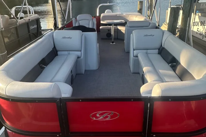 Red pontoon sitting at the dock