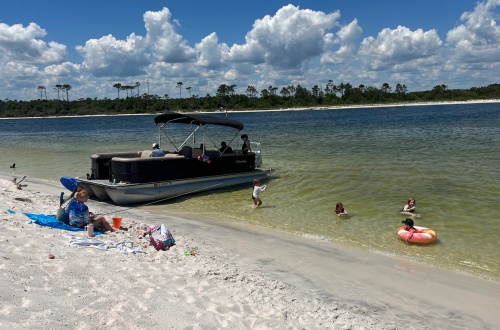 Frisky Mermaid tritoon pontoon rental beached at Sand Island near Pensacola Beach Florida